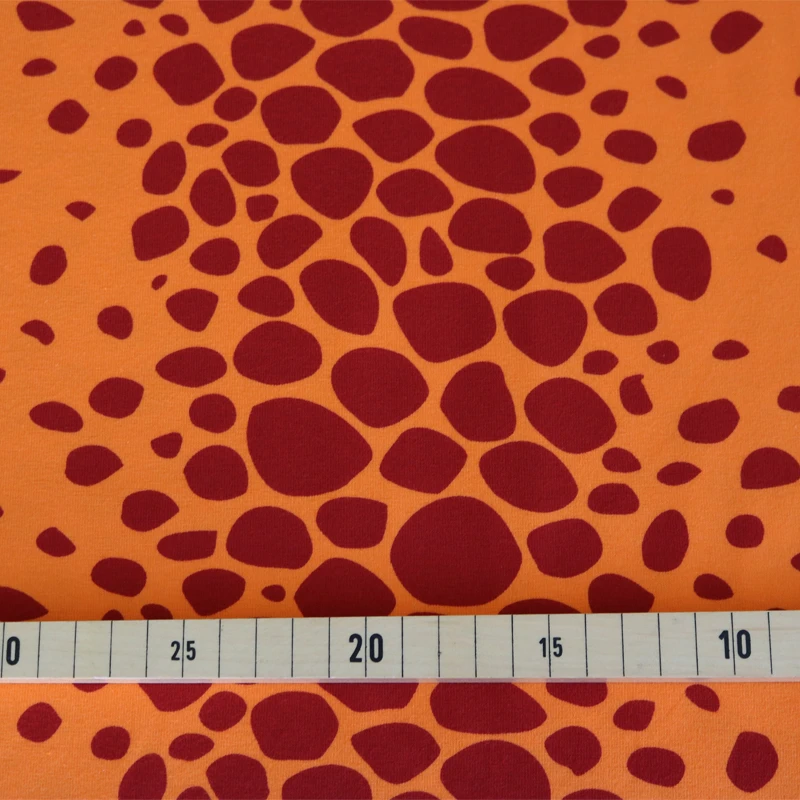 Jersey Stoff orange Drachenhaut -  Drache Kokosnuss