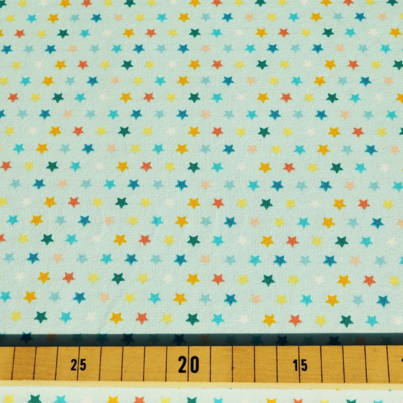 Jersey Stoff bunte Sterne hellblau 0,14m